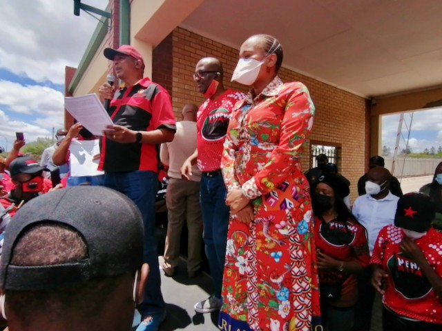 Photo of protesters and officials