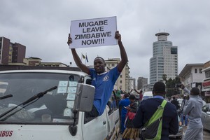 Thousands of Zimbabweansmarch for the removal of Robert Mugabe.