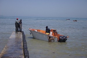 Photo of fishing boat and people