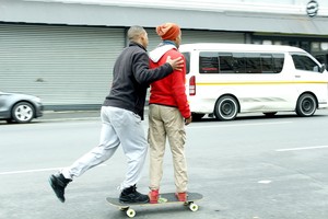 Photo of two boys skateboarding