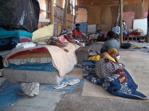 Photo of people living in large shack