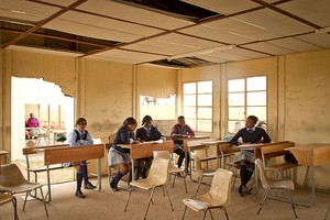 Photo of school children in dilapidated classroom 
