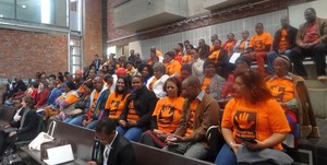 Photo of Black Sash members in orange t-shirts at Constitutional Court