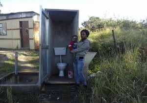 Photo of woman and child in front of toilet