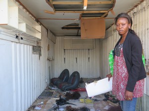 Photo of woman inside looted shop