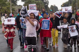 About 100 hundreds residents in Hanover Park block streets protesting against gang violence.