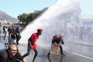 Photo of water cannon spraying people