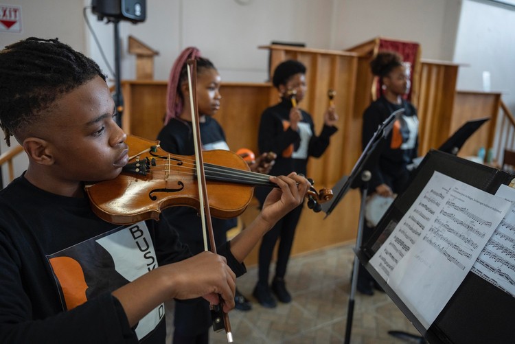 The Buskaid Soweto String Ensemble performs a free community classical music concert in the Dutch Reformed Church in Diepkloof. - Ihsaan Haffejee