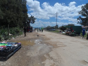 Photo of pothole-ridden road in Addo's town centre