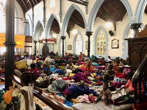Photo of refugees in church