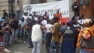 Photo of people dancing outside court