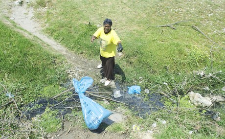 Photo of woman throwing faeces.