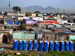 Photo of a row of blue portable toilets
