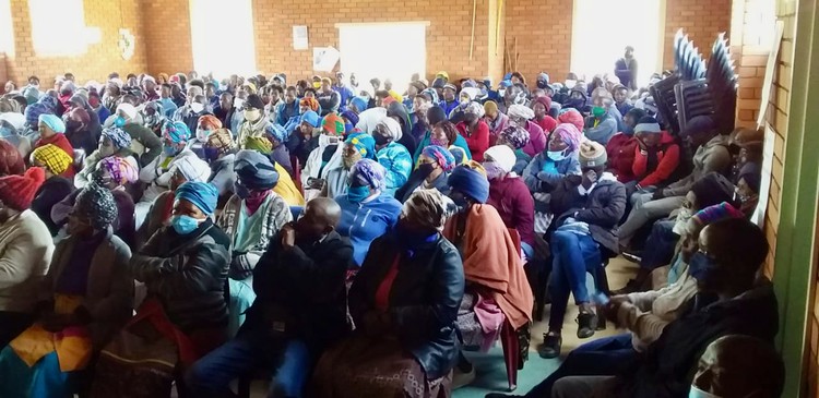Photo of a community meeting in a hall