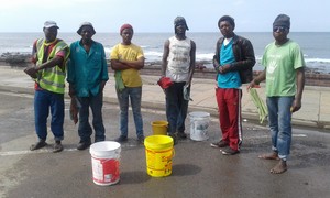 Photo of workers at car wash on beachfront
