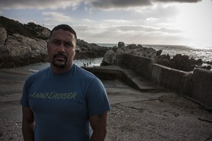 Photo of man against shore background