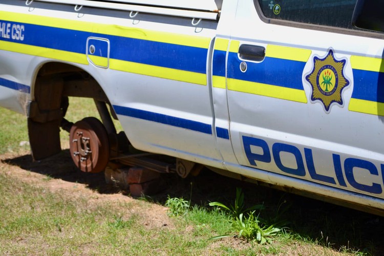 Photo of a police van without a tyre