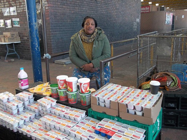 Photo of a woman at her stall 